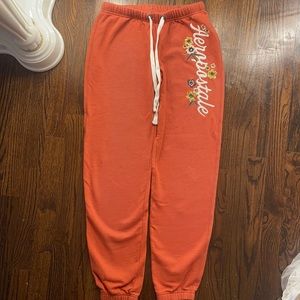 Orange/tan Aeropostale joggers with cute design